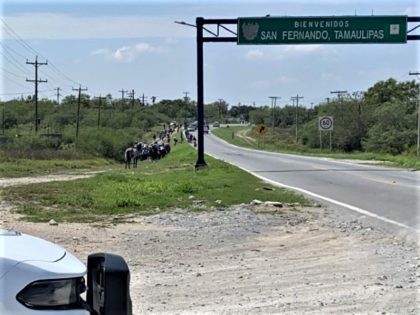 Migrants walk toward Texas border after being removed from buy by Mexican police. (Photo: Cartel Chronicles)