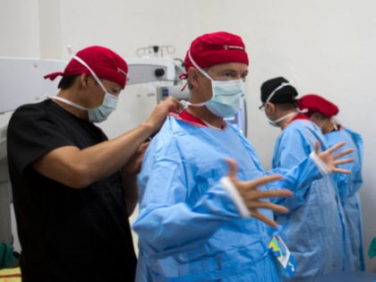 In this Aug. 17, 2015 photo, Republican presidential candidate Sen. Rand Paul, R-Ky. gets ready to perform cataract surgery in Cap-Haitien, Haiti, as part of a humanitarian mission to the island nation. Paul participated in a similar mission with the same group last summer in Guatemala.( AP Photo/Dieu Nalio Chery)