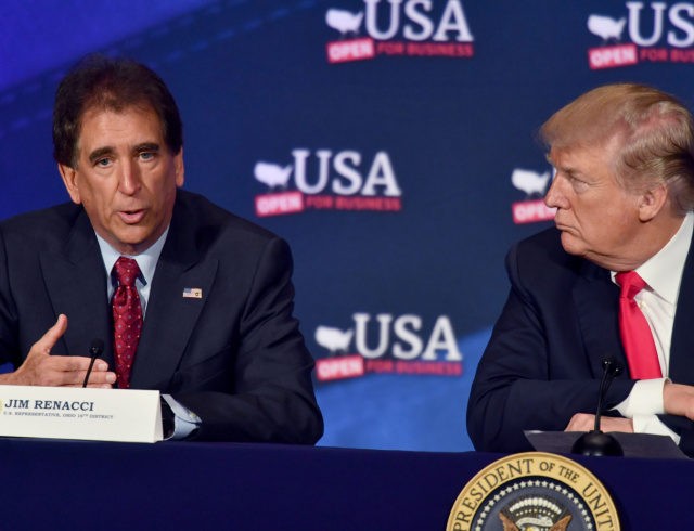 US President Donald Trump listens to US Representative Jim Renacci (L) during a roundtable discussion on the new tax law at the Cleveland Public Auditorium and Conference Center on May 5, 2018, in Cleveland, Ohio. (Photo by Nicholas Kamm / AFP) (Photo credit should read NICHOLAS KAMM/AFP via Getty Images)