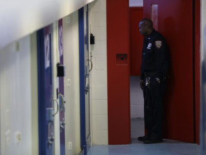 A corrections officers prepares for a news conference in an enhanced supervision housing unit on Rikers Island in New York, Thursday, March 12, 2015. New York City Mayor Bill de Blasio has unveiled a comprehensive plan to curb jail violence after a visit to the problem-plagued Rikers Island jail complex. …