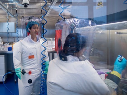 Chinese virologist Shi Zhengli (L) is seen inside the P4 laboratory in Wuhan, capital of C