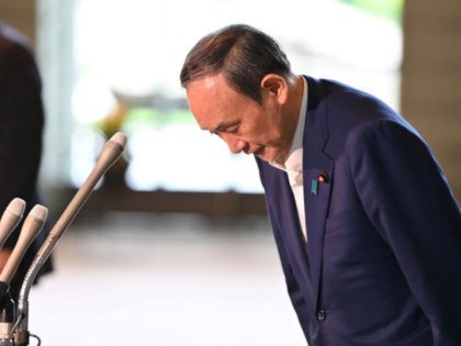 Japan's Prime Minister Yoshihide Suga bows during a press conference at the prime minister's office in Tokyo on September 3, 2021, following his announcement that he will not seek re-election for Liberal Democratic Party (LDP) leadership this month. (Photo by Kazuhiro NOGI / AFP) (Photo by KAZUHIRO NOGI/AFP via Getty …