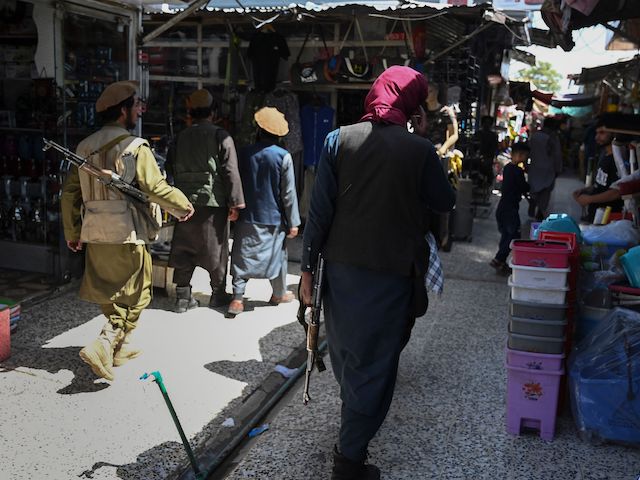 Taliban fighters arrive to shop at Bush market in Kabul on September 9, 2021. (Photo by Aamir QURESHI / AFP) (Photo by AAMIR QURESHI/AFP via Getty Images)
