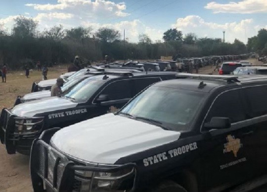 Dozens of Texas DPS Highway Patrol vehicles line up to stop the flow of migrants into the makeshift camp in Del Rio, Texas. (Photo: Texas Department of Public Safety)