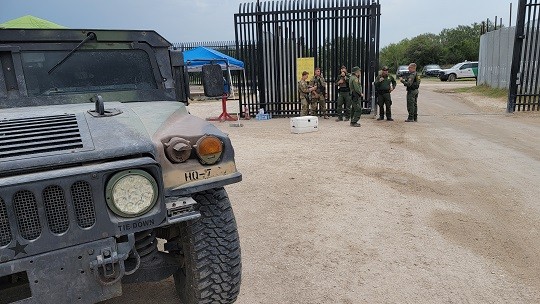 Texas National Guardsmen and DPS troopers assist Border Patrol in securing entrance to Del Rio Migrant Camp. (Photo: Bob Price/Breitbart Texas)