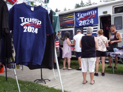 Vendors sell political merchandise before a rally with former President Donald Trump at th