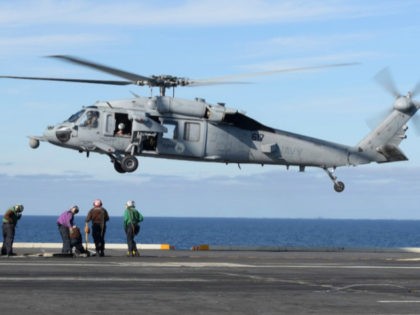 In this March 19, 2017, photo released by the U.S. Navy, an MH-60S Sea Hawk helicopter prepares to land on the flight deck of the aircraft carrier USS Nimitz in the Pacific Ocean. The Navy declared five missing sailors dead Saturday, Sept. 4, 2021, nearly a week after their helicopter, …