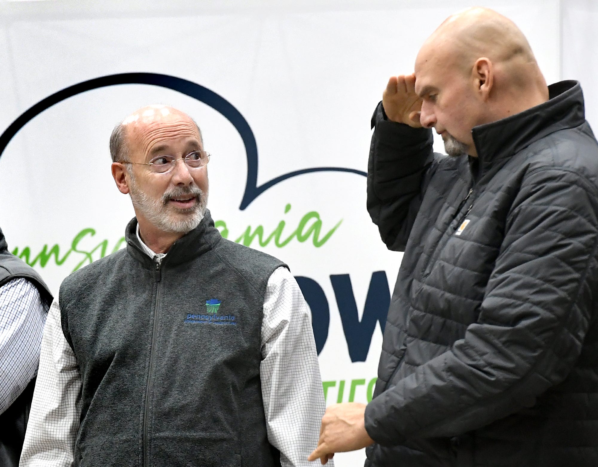 Lt. Gov. John Fetterman salutes Gov. Tom Wolf as Wolf was introduced during opening ceremonies at the 104th Pennsylvania Farm Show Saturday, Jan. 4, 2020. Saturday was the first day of the week-long farm show. Bill Kalina photo