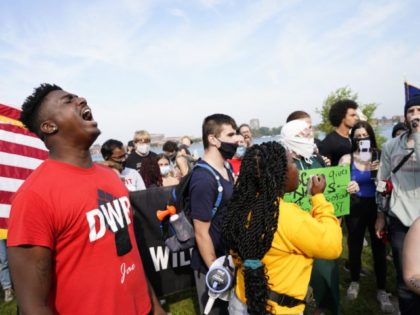 Sept. 14, 2021; Detroit, MI, USA; Jay Bass, left, leads chants as Rai Lanier speaks on behalf of Detroit Will Breath in opposition of former Detroit Police Chief James Craig before he officially announces his run for Michigan governor, as a republican candidate, Tuesday, Sept. 14, 2021 from Belle Isle …