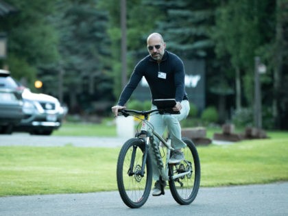 Uber CEO Dara Khosrowshahi rides a bike