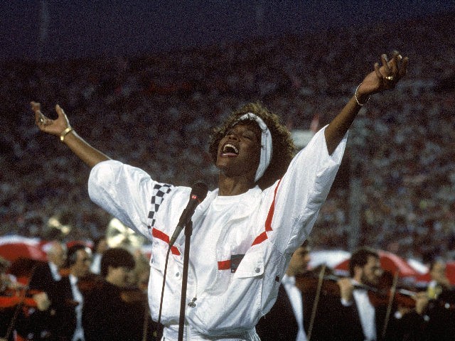 TAMPA, FL - JANUARY 27: Whitney Houston sings the National Anthem before a game with the New York Giants taking on the Buffalo Bills prior to Super Bowl XXV at Tampa Stadium on January 27, 1991 in Tampa, Florida. The Giants won 20-19. (Photo by George Rose/Getty Images)