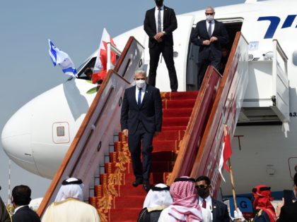 Israeli Foreign Minister Yair Lapid disembarks upon arrival at the Bahrain International A
