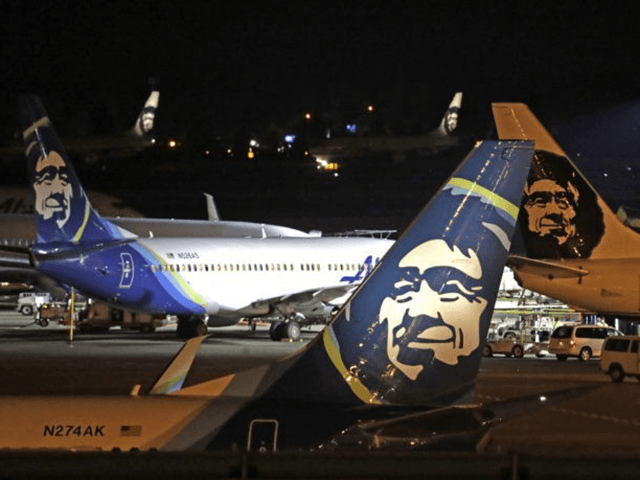 Alaska Airlines planes sit on the tarmac at Sea-Tac International Airport Friday evening,