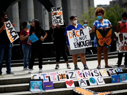 People attend a protest supporting DACA, Deferred Action for Childhood Arrivals, at Foley