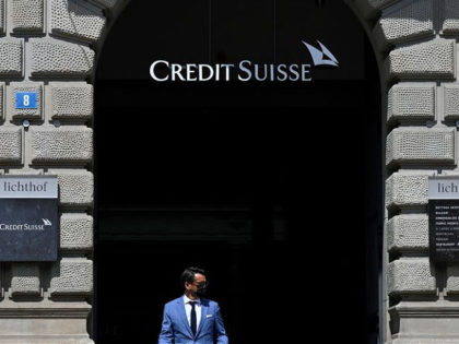 People pass by the headquarters of Swiss bank Credit Suisse in Zurich on August 9, 2021. (Photo by SEBASTIEN BOZON / AFP) (Photo by SEBASTIEN BOZON/AFP via Getty Images)