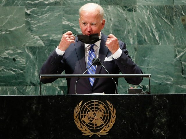 US President Joe Biden takes off his protective facemask due to the coronavirus disease (Covid-19) pandemic as he arrives to speak at the 76th Session of the UN General Assembly on September 21, 2021 in New York. - The summit will feature the first speech to the world body by …
