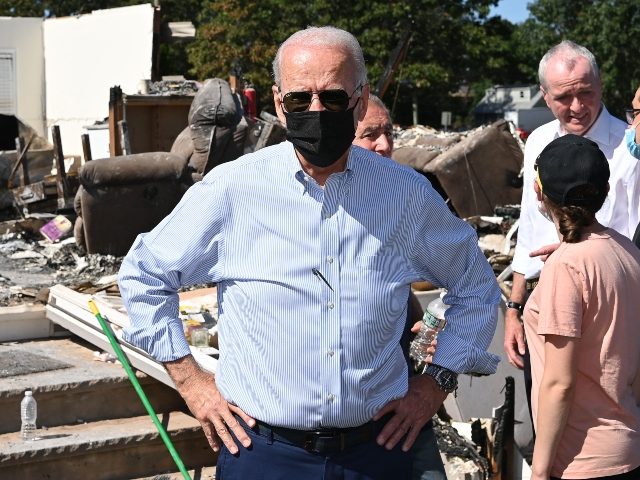 US President Joe Biden(C) tours a neighbourhood affected by Hurricane Ida in Manville, New Jersey on September 7, 2021. - President Joe Biden headed Tuesday to storm-ravaged New York and New Jersey, just days after inspecting the damage caused by Hurricane Ida in Louisiana. Biden -- who is pushing a …