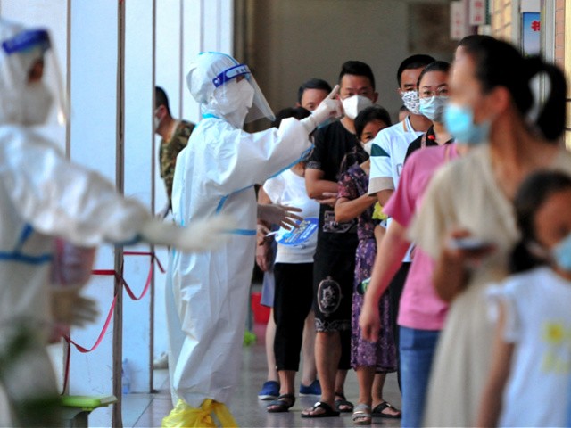 Residents queue to undergo nucleic acid tests for the Covid-19 coronavirus in Xianyou county, Putian city, in China's eastern Fujian province on September 13, 2021. - China OUT (Photo by - / CNS / AFP) / China OUT (Photo by -/CNS/AFP via Getty Images)