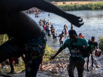 CIUDAD ACUNA, MEXICO - SEPTEMBER 20: Haitian immigrants cross the Rio Grande back into Mexico from Del Rio, Texas on September 20, 2021 to Ciudad Acuna, Mexico. As U.S. immigration authorities began deporting immigrants back to Haiti from Del Rio, thousands more waited in a camp under an international bridge …