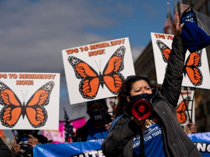 WASHINGTON, DC - FEBRUARY 23: Activists and citizens with temporary protected status (TPS) march along 16th Street toward the White House in a call for Congress and the Biden administration to pass immigration reform legislation on February 23, 2021 in Washington, DC. Last week, Democrats in Congress unveiled a wide-ranging …