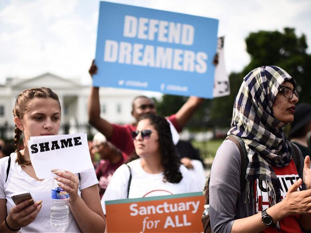 Immigrants and supporters demonstrate during a rally in support of the Deferred Action for Childhood Arrivals (DACA) in front of the White House on September 5, 2017 in Washington DC. US President Donald Trump has rescinded the program, ending amnesty for 800,000 young immigrants brought to the US illegally as …