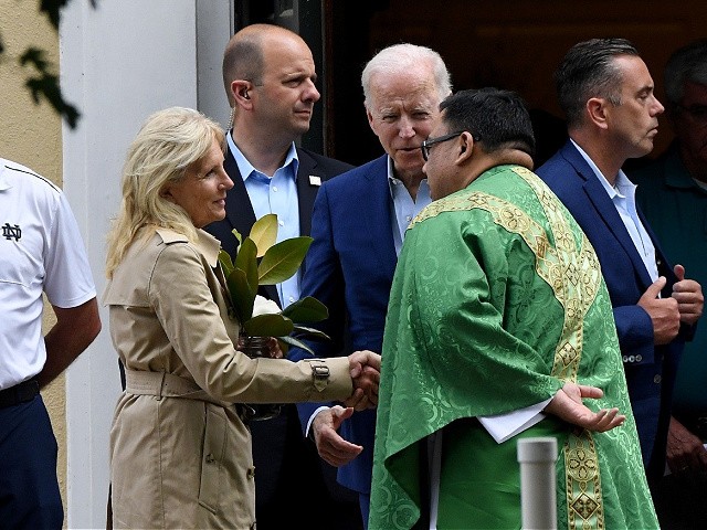 US President Joe Biden (C) and First Lady Jill Biden (L) speaks with a priest as they leave St. Joseph on the Brandywine Catholic Church in Wilmington, Delaware, June 19, 2021. - US Roman Catholic bishops issued a challenge on June 18 to President Biden over his support for abortion rights, agreeing to draft a statement on the meaning of holy communion which could potentially be used to deny the sacred rite to the US leader. (Photo by Olivier DOULIERY / AFP) (Photo by OLIVIER DOULIERY/AFP via Getty Images)