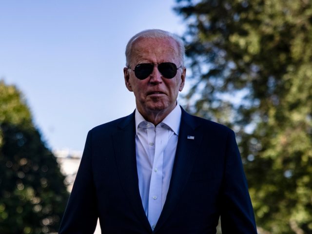 WASHINGTON, DC - SEPTEMBER 26: U.S. President Joe Biden walks over to gathered reporters at the White House after spending his weekend at Camp David on September 26, 2021 in Washington, DC. The president returns as the deadline for debt ceiling negotiations approaches and a massive infrastructure bill is still …