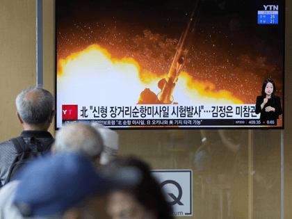 People watch a news program that was showing part of a North Korean handout photo that says, "North Korea's long-range cruise missiles tests," in Seoul, South Korea, Monday, Sept. 13, 2021. North Korea says it successfully test-fired newly developed long-range cruise missiles over the weekend, its first known testing activity …