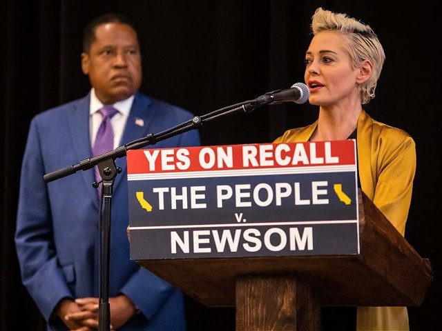 Conservative talk show host and gubernatorial recall candidate Larry Elder listens to Actress Rose McGowan speak at a press conference on September 12, 2021 in Los Angeles, California. - Rose McGowan and the candidate for governor Larry Elder discussed her allegations that Jennifer Siebel Newsom, Governor Gavin Newsom's wife, tried …