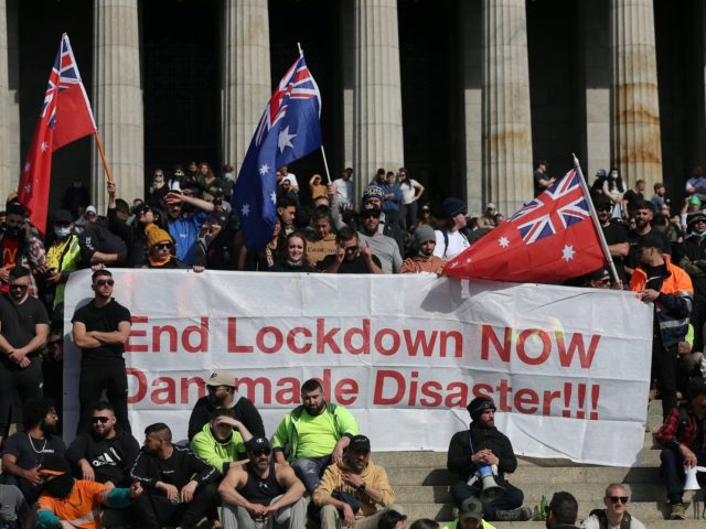 Construction workers and demonstrators on the steps of the Shrine of Remembrance protest a