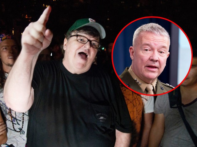 Filmmaker Michael Moore gestures during a visit to the "Occupy Wall Street" prot
