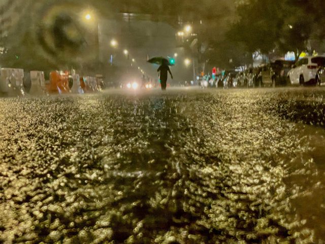 NEW YORK, NY - SEPTEMBER 01: A person makes their way in rainfall from the remnants of Hurricane Ida on September 1, 2021, in the Bronx borough of New York City. The once category 4 hurricane passed through New York City, dumping 3.15 inches of rain in the span of …