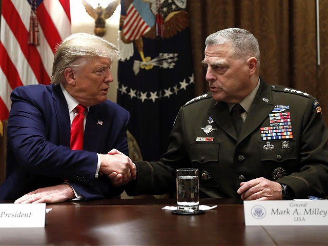 President Donald Trump shakes hands with Chairman of the Joint Chiefs of Staff Gen. Mark Milley during a briefing with senior military leaders in the Cabinet Room at the White House in Washington, Monday, Oct. 7, 2019. (AP Photo/Carolyn Kaster)