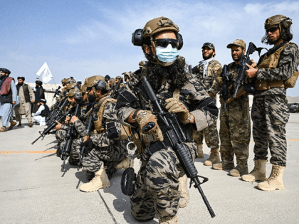 Members of the Taliban Badri 313 military unit take up positions at the airport in the Afghan capital Kabul after the US pulled its last troops out of the country