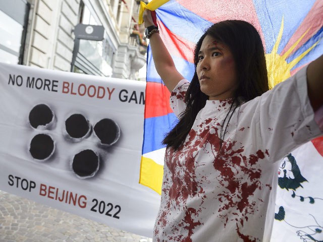 Pro-Tibet demonstrators hold a protest on June 10, 2015 outside Lausanne Palace hotel wher