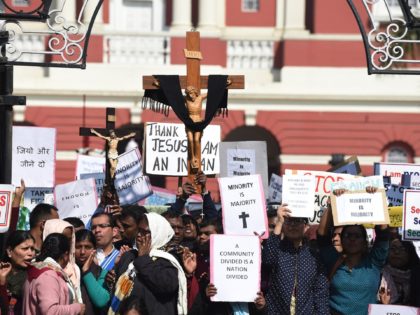 Minority Indian Christians demonstrate with crucifixes and placards outside the Sacred Heart Cathedral following recent attacks on churches in New Delhi on February 5, 2015. Hundreds of minority Christians protested outside a church in the Indian capital February 5 as priests and demonstrators said they feel insecure under Prime Minister …