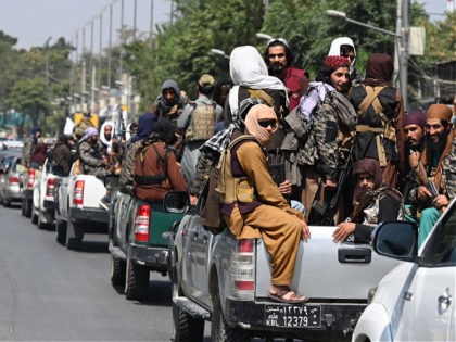 A convoy of Taliban fighters patrol along a street in Kabul on September 2, 2021. (Photo b