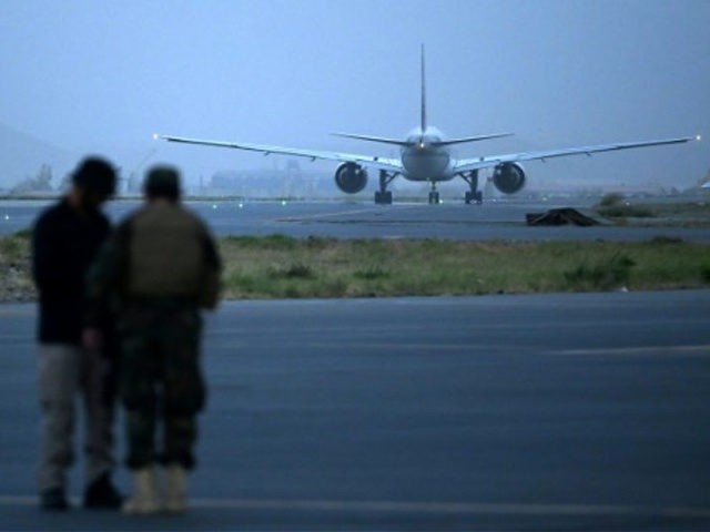 A Qatar Airways aircraft bound to Qatar prepares to take off at the airport in Kabul on September 10, 2021. - A second charter flight left Afghanistan on September 10 carrying foreigners and Afghans to Qatar in a sign the country's main airport was close to resuming commercial operations, as …