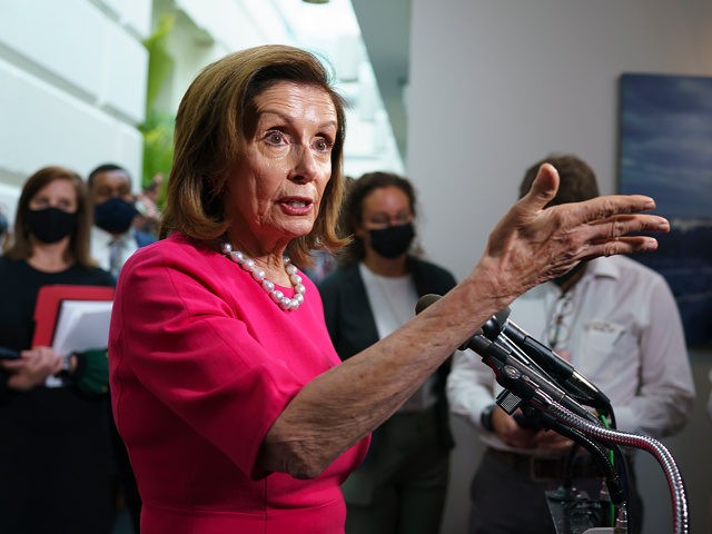 House Speaker Nancy Pelosi, D-Calif., updates reporters following a Democratic Caucus meeting in the basement of the Capitol in Washington, Tuesday, Sept. 28, 2021. Work continues behind the scenes on President Joe Biden's domestic agenda and a bill to fund the the government. (AP Photo/J. Scott Applewhite)