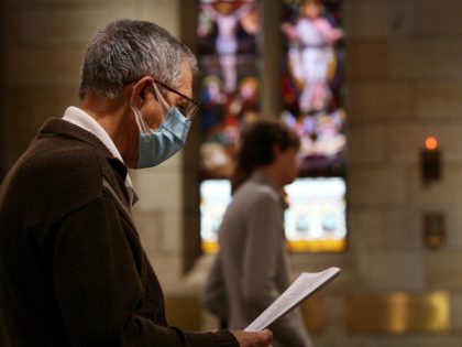 SYDNEY, AUSTRALIA - OCTOBER 25: A parishioner wears a face mask during the 'Twenty-First Sunday after Pentecost' service at St Paul's Anglican Church in Burwood on October 25, 2020 in Sydney, Australia. COVID-19 restrictions eased further in New South Wales from Friday 23 October to allow religious gatherings and places …