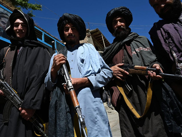 Taliban fighters pose for a picture in front of a bakery at a market area in Khenj district, Panjshir Province on September 15, 2021, days after the hardline Islamist group announced the capture of the last province resisting to their rule. - Under late Afghan commander Ahmad Shah Massoud, the …