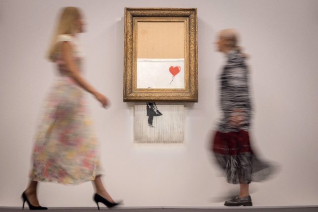 The painting, originally entitled 'Girl with Balloon', sold for nearly £1.1 million almos
