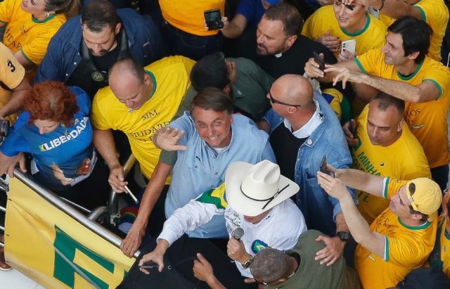 Enthusiastic supporters crowd Brazilian President Jair Bolsonaro at the September 7, 2021,