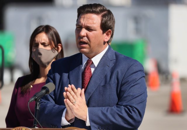 A federal judge has ruled against a controversial 'anti-riot' law pushed by Florida Governor Ron DeSantis, saying it could threaten the freedom of expression of Floridians (AFP/JOE RAEDLE)