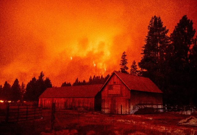 Flames consume multiple homes as the Caldor fire pushes into the Echo Summit area, California on August 30, 2021. - At least 650 structures have burned and thousands more are threatened as the Caldor fire moves into the resort community of South Lake Tahoe, California. Thousands of people were ordered …
