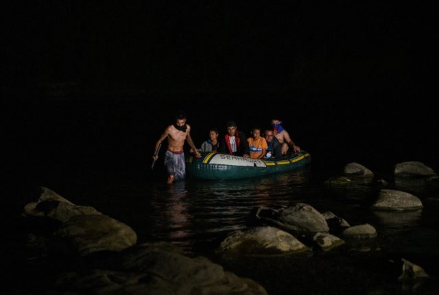 Migrants arrive in the United States near Roma, Texas after crossing the Rio Grande from M