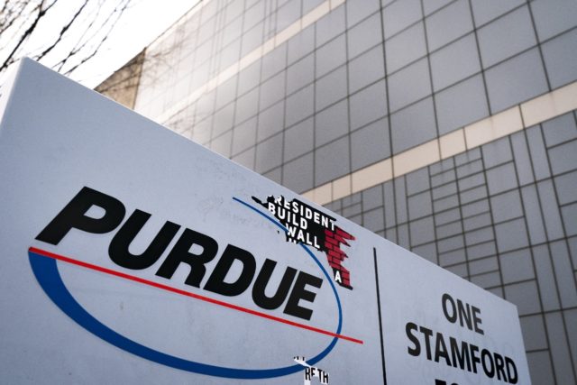 The US government is seeking to block a settlement with Purdue Pharma that would prevent f