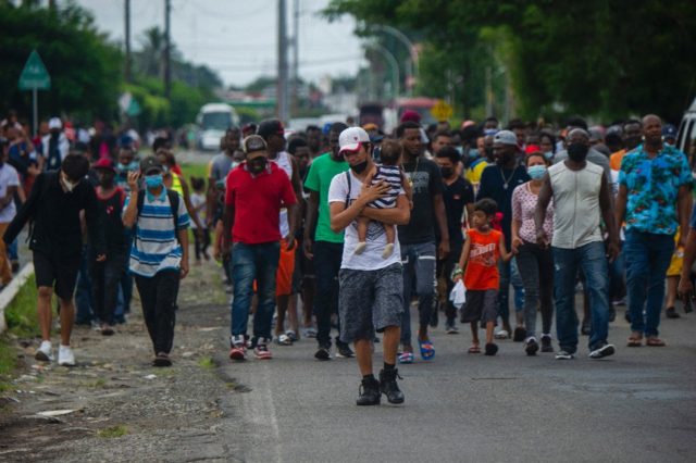 Haitian and Central American migrants march to the Siglo XXI Migratory Station in Tapachul