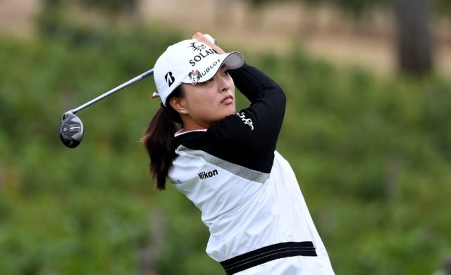 South Korea's Ko Jin-young hits a tee shot on the eighth hole during the second round of t
