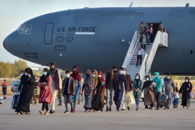 Refugees from Afghanistan disembark from a US air force aircraft at the Rota naval base in southern Spain, before heading to the United States.